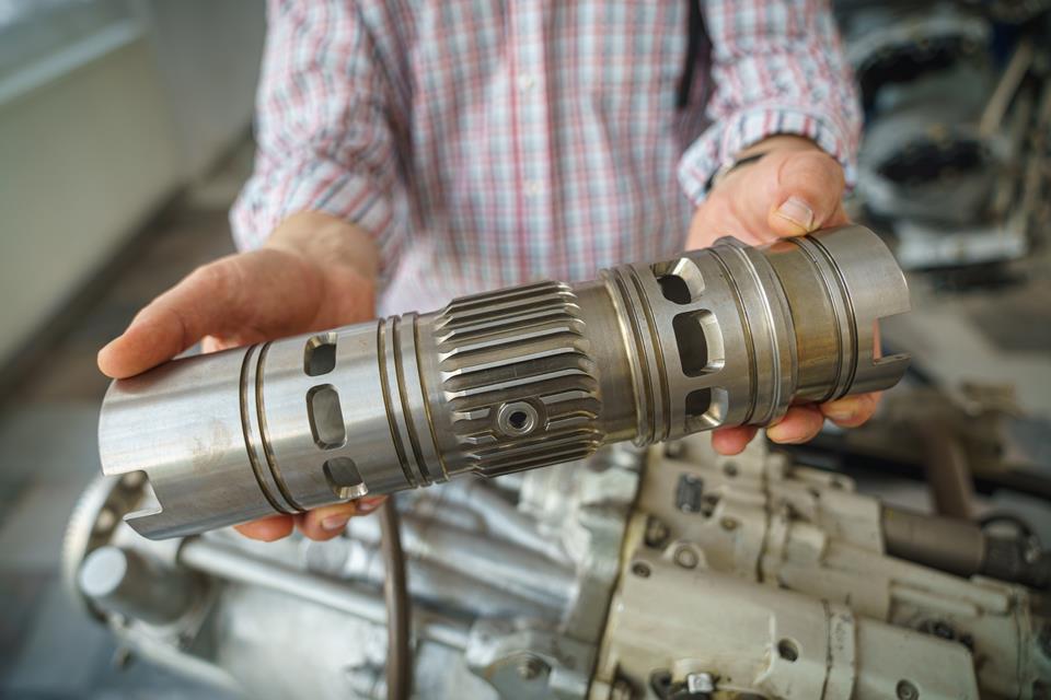 Man holding an engine module.