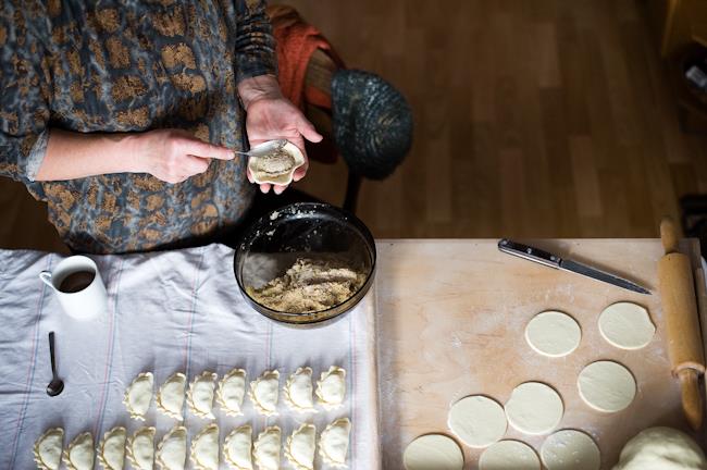 Woman is filling dumplings